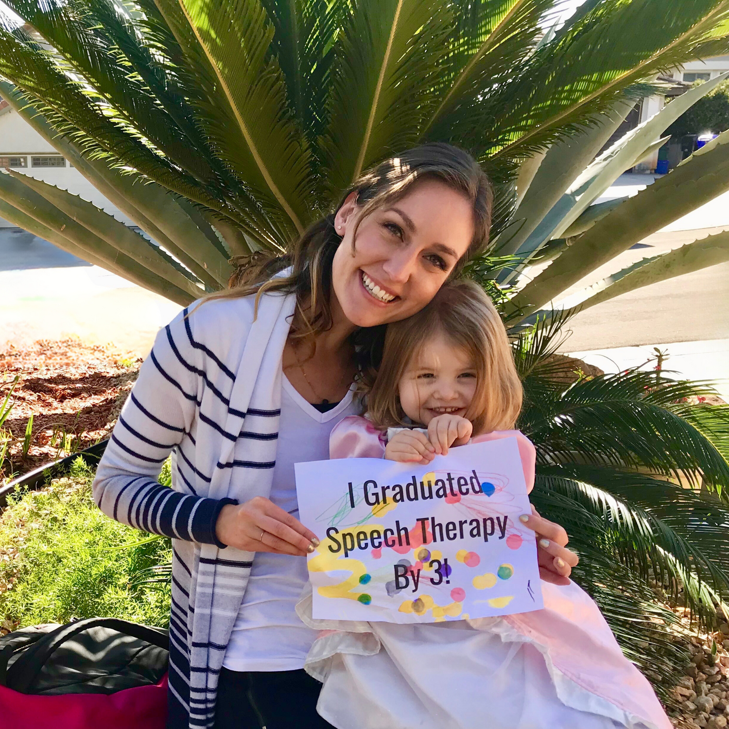 kayla and child holding sign